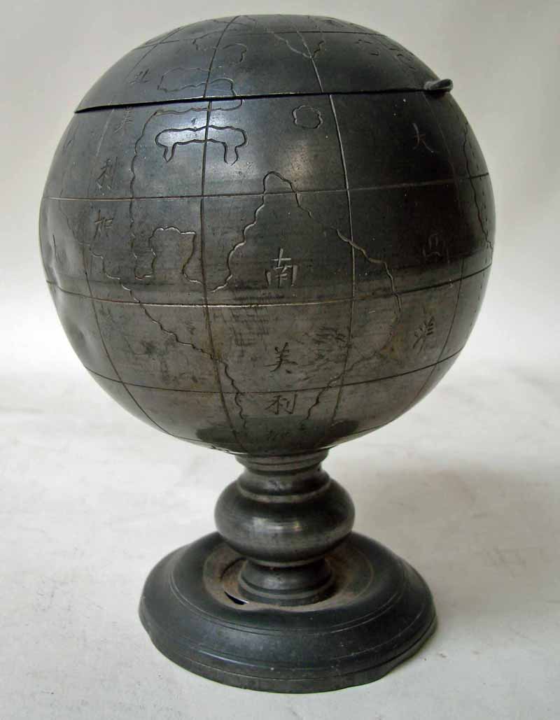 An early 20th century Chinese pewter tea caddy in the form of a terrestrial globe with hinged
