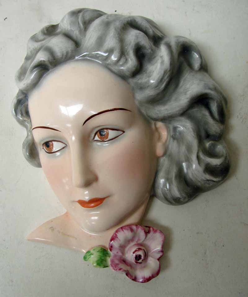 A Goebel art deco portrait wall mask depicting a young woman, impressed marks FX 61/2, 18cm high