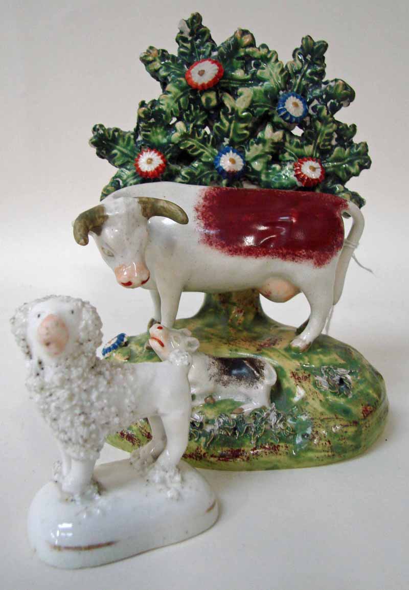 An early 19th century Staffordshire bocage group as a cow and recumbent calf by Walton, impressed