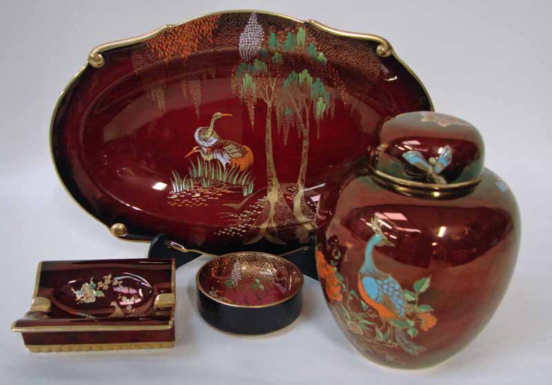 A Carlton ware Rouge Royale dish of shaped, oval form decorated with cranes beneath weeping