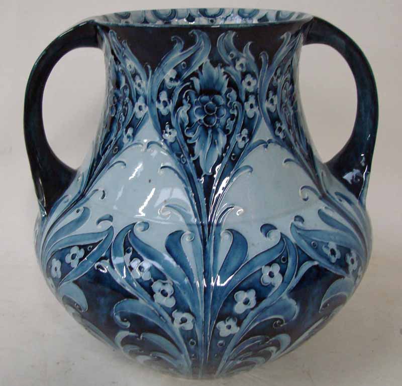 A large early 20th century Moorcroft Florian ware vase of two handled bulbous form, tubeline