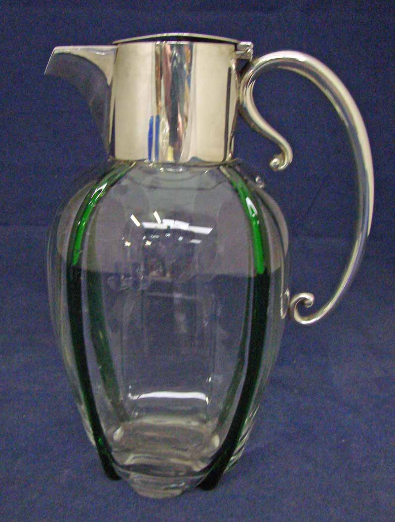 A late Victorian silver mounted glass claret jug, possibly Richardson, the ovoid clear glass body