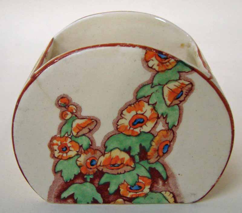 Clarice Cliff Wilkinsons, a Stamford style sucrier decorated in the Sunshine pattern with