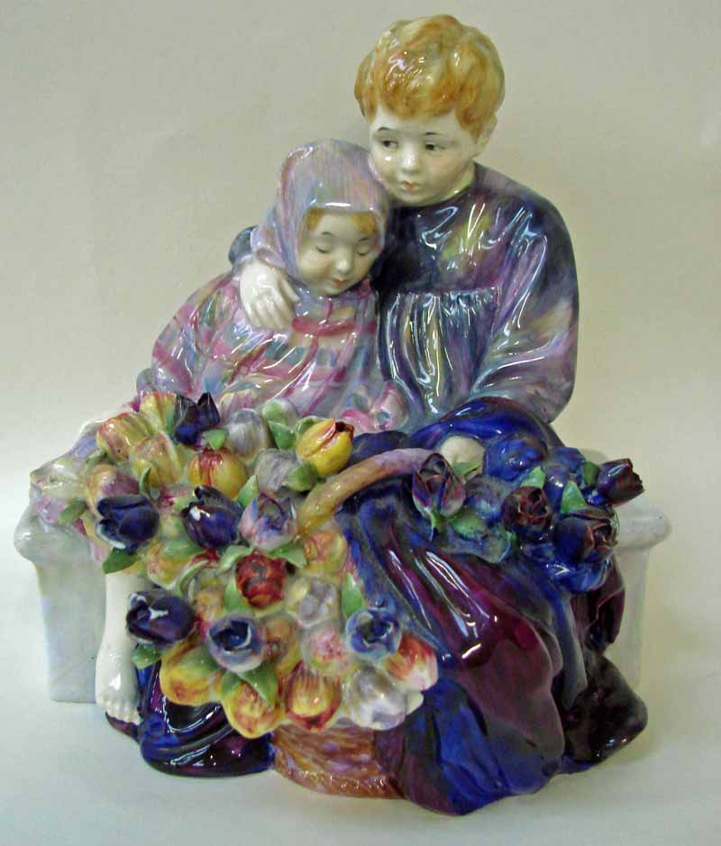 An early Royal Doulton pottery group, The Flower Sellers Children, HN1206, (hairlines to base,