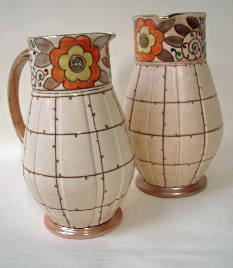 Charlotte Rhead for Bursley ware, two pottery jugs, shape number 652 and the smaller number 653,