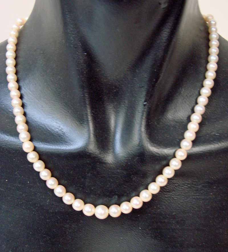 A single strand of seventy-one Japanese Akoya cultured pearls, graduated, medium cream colour with