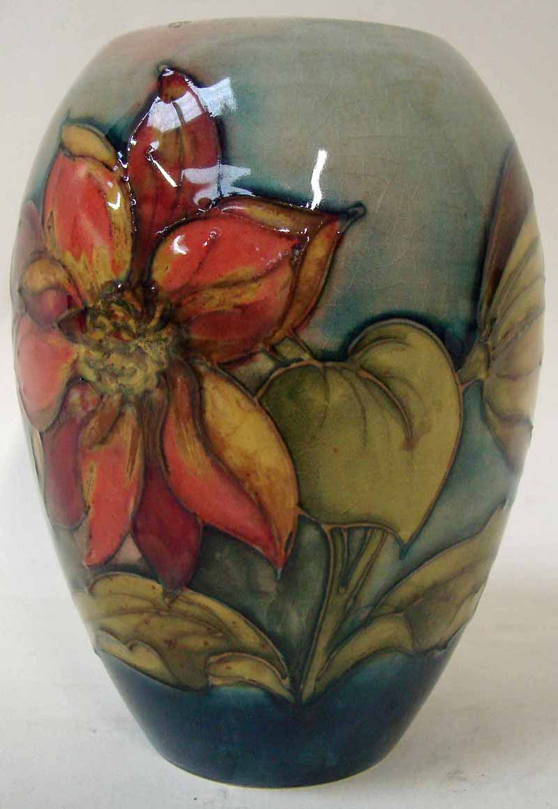 A William Moorcroft vase of ovoid form, tubeline decorated in an early Clematis design on a light