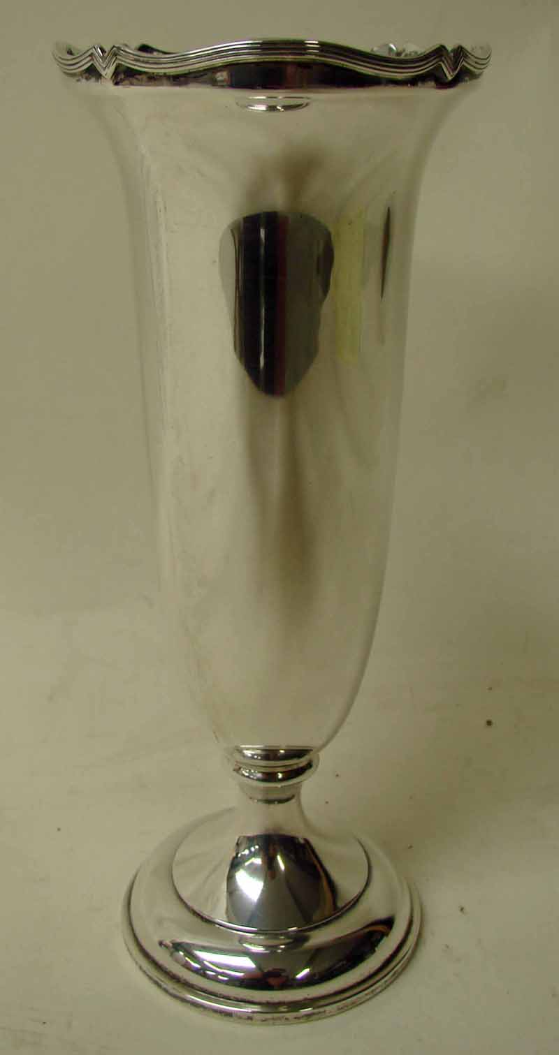 An early 20th century silver flower vase by Asprey, of trumpet shape with shaped ribbed rim,