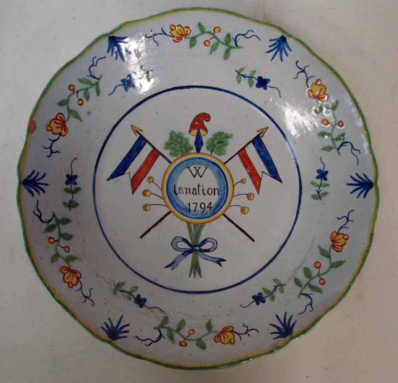 A French 18th century faience shallow bowl commemorating the formation of the New Republic, painted