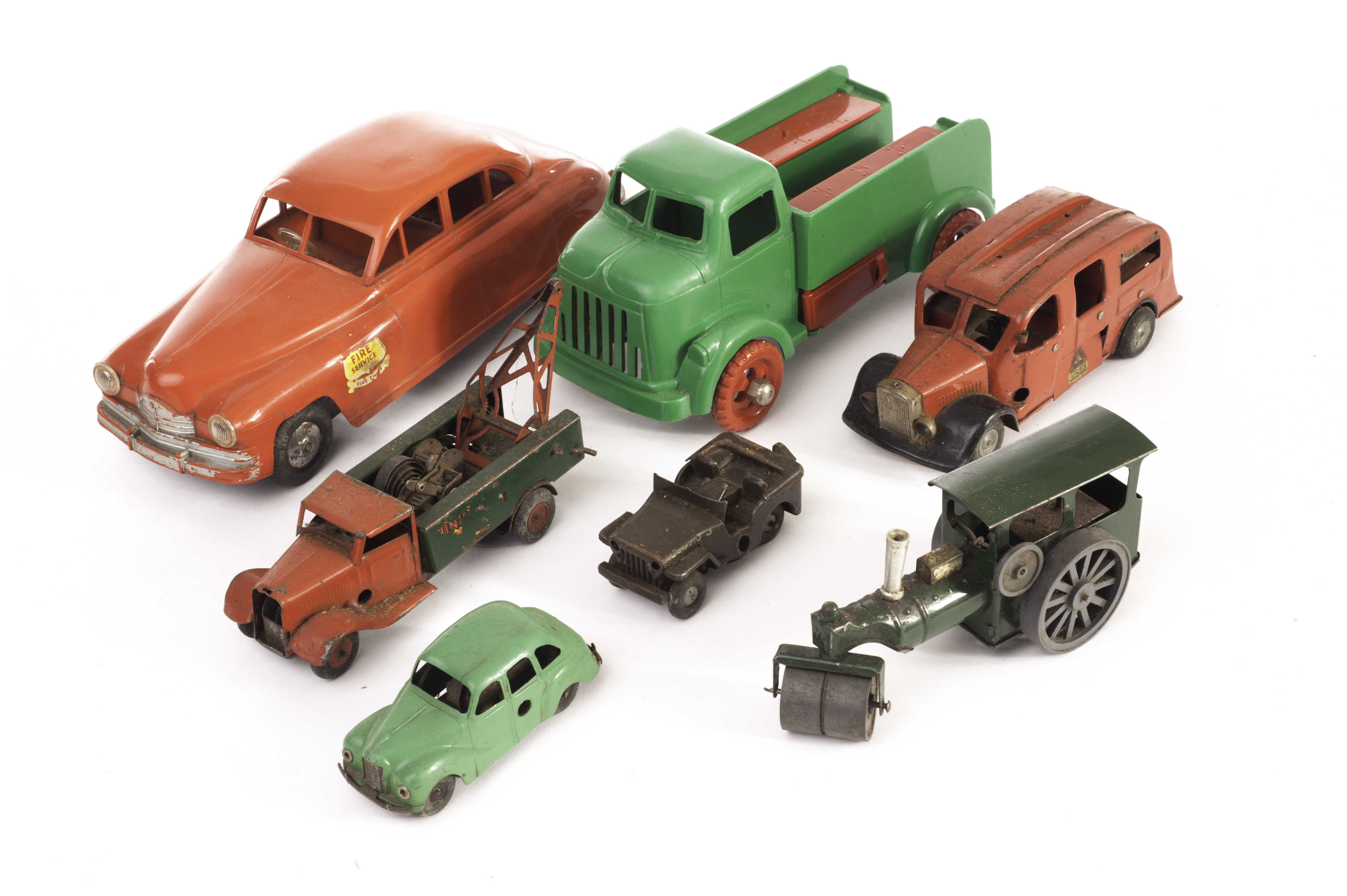 A Penguin Toys Recovery Truck, green plastic body with red hubs, compartments contain three metal
