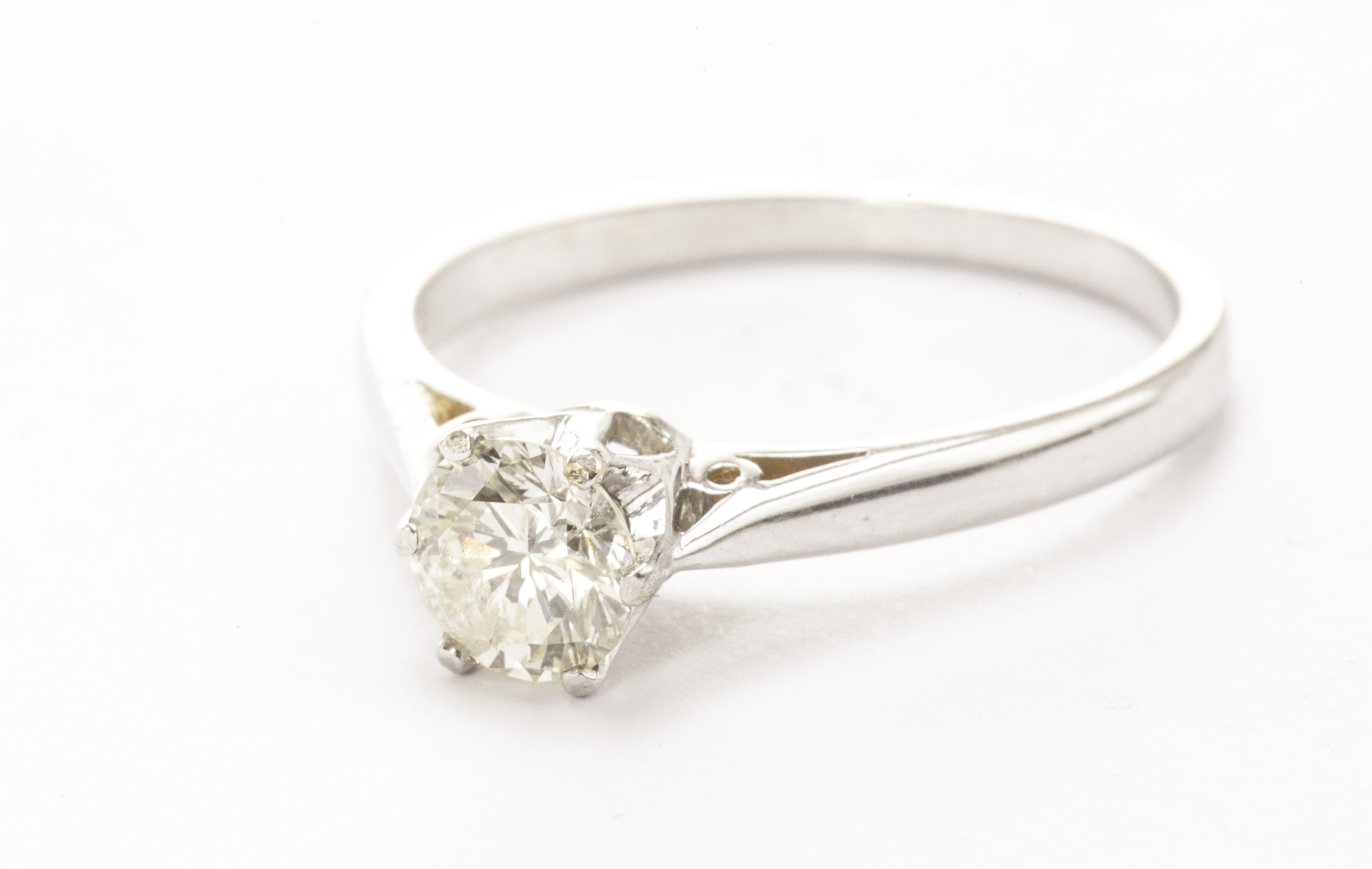 A diamond solitaire engagement ring, the approx 0.5ct brilliant cut in claw mount, in modern 18ct