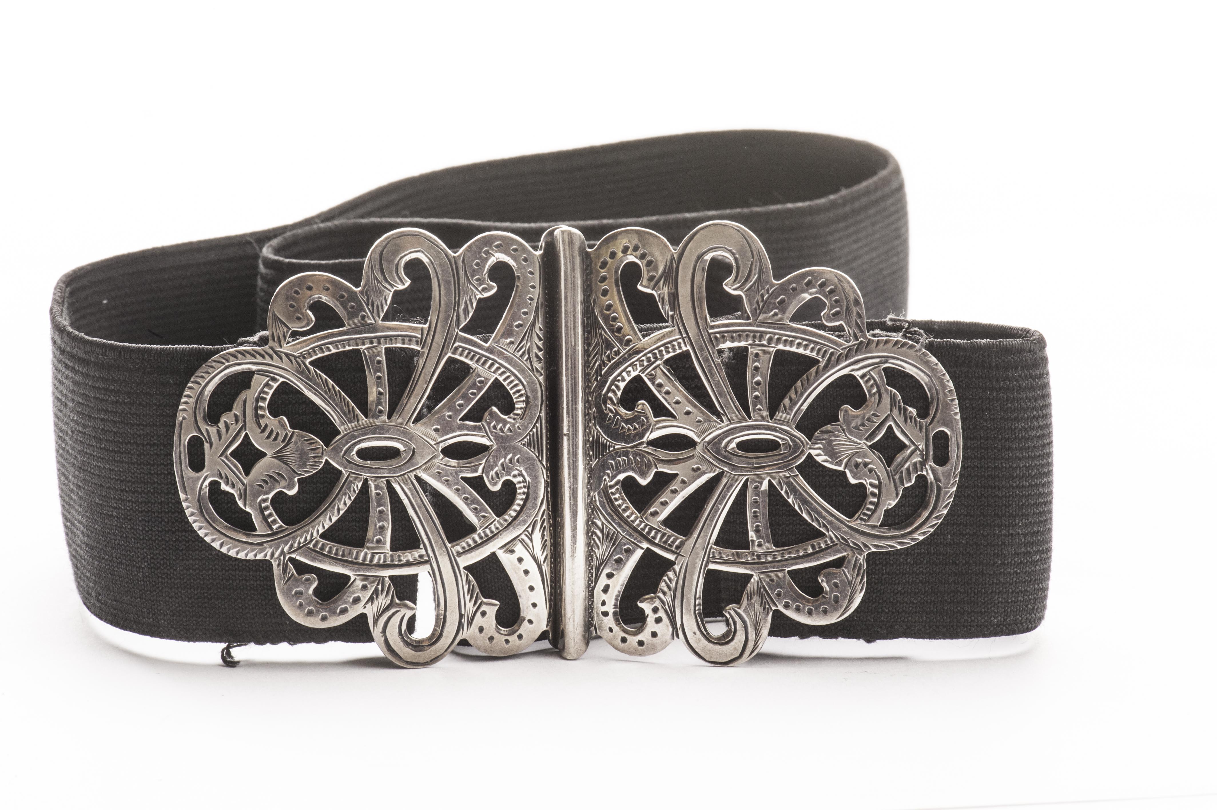 An Edward VII silver nurses belt buckle, the shaped pierced and engraved double clasp with black