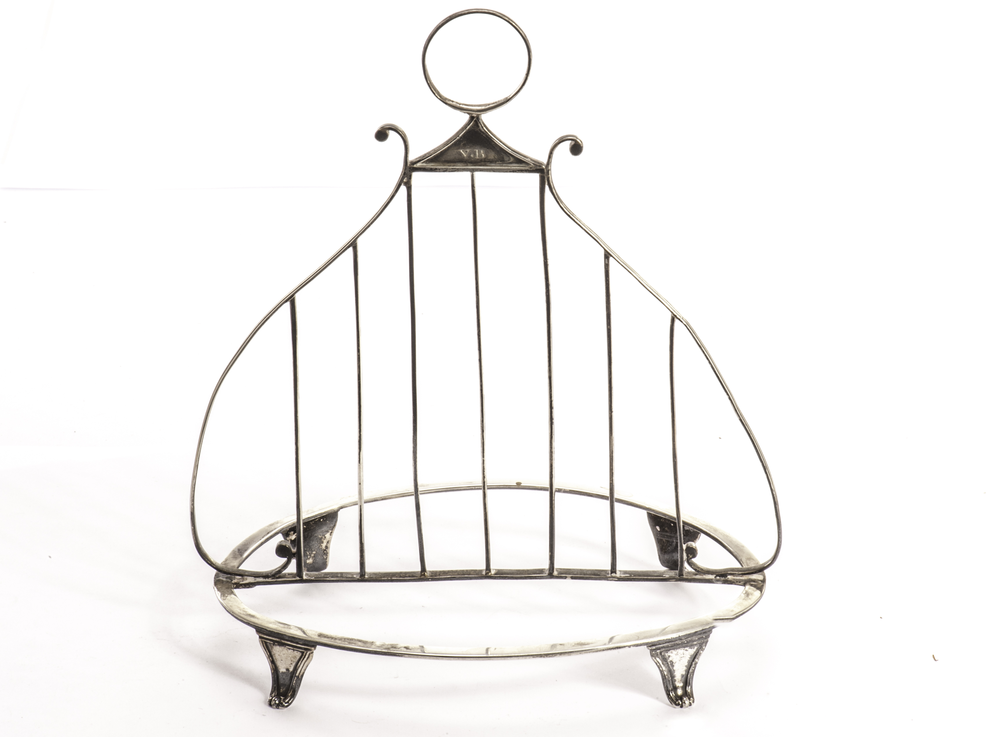 A rare George III silver letter rack by NH, oval base frame on four scroll feet with sectioned