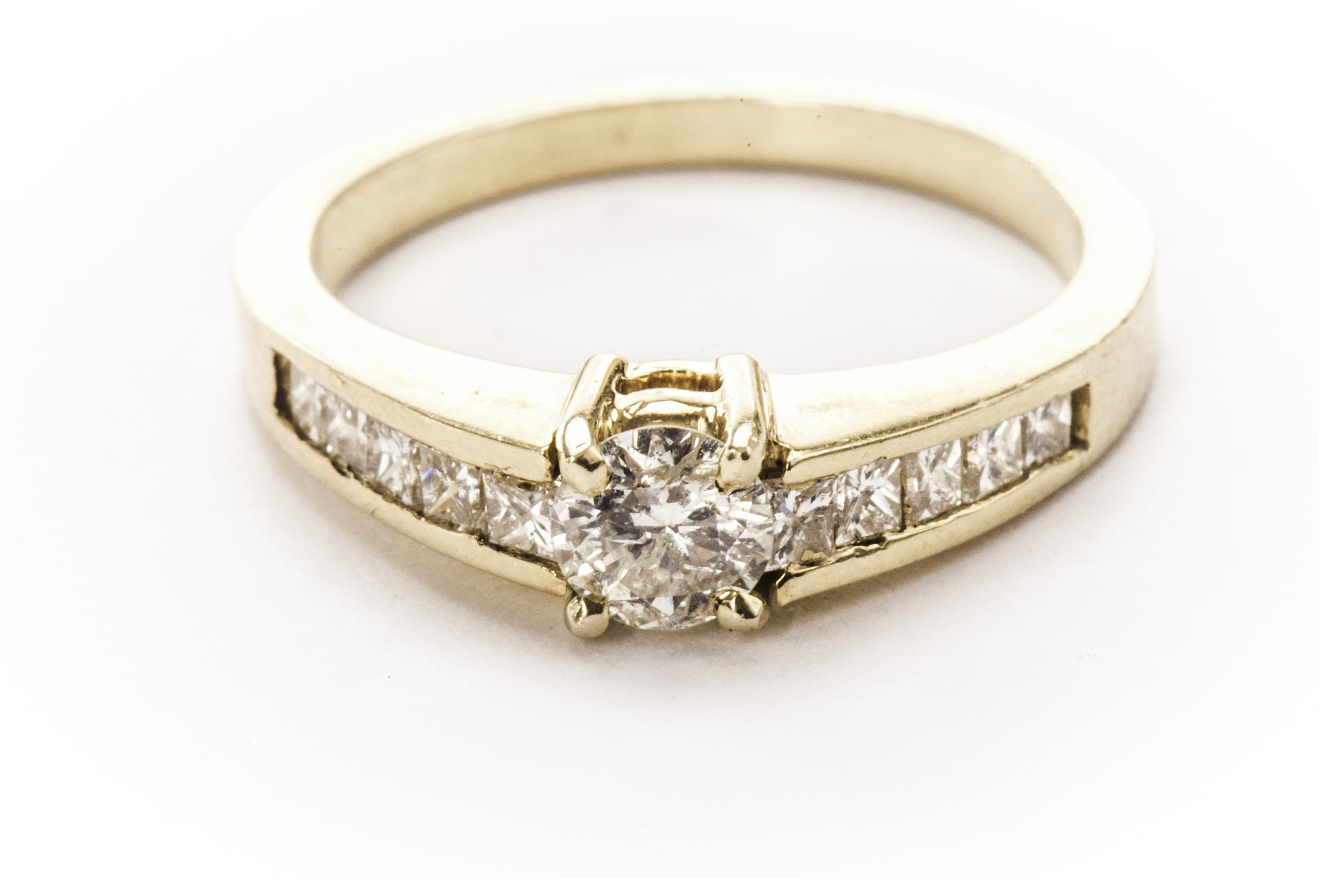 A modern diamond engagement ring, having a brilliant cut of approx 0.3ct in four claw mount and