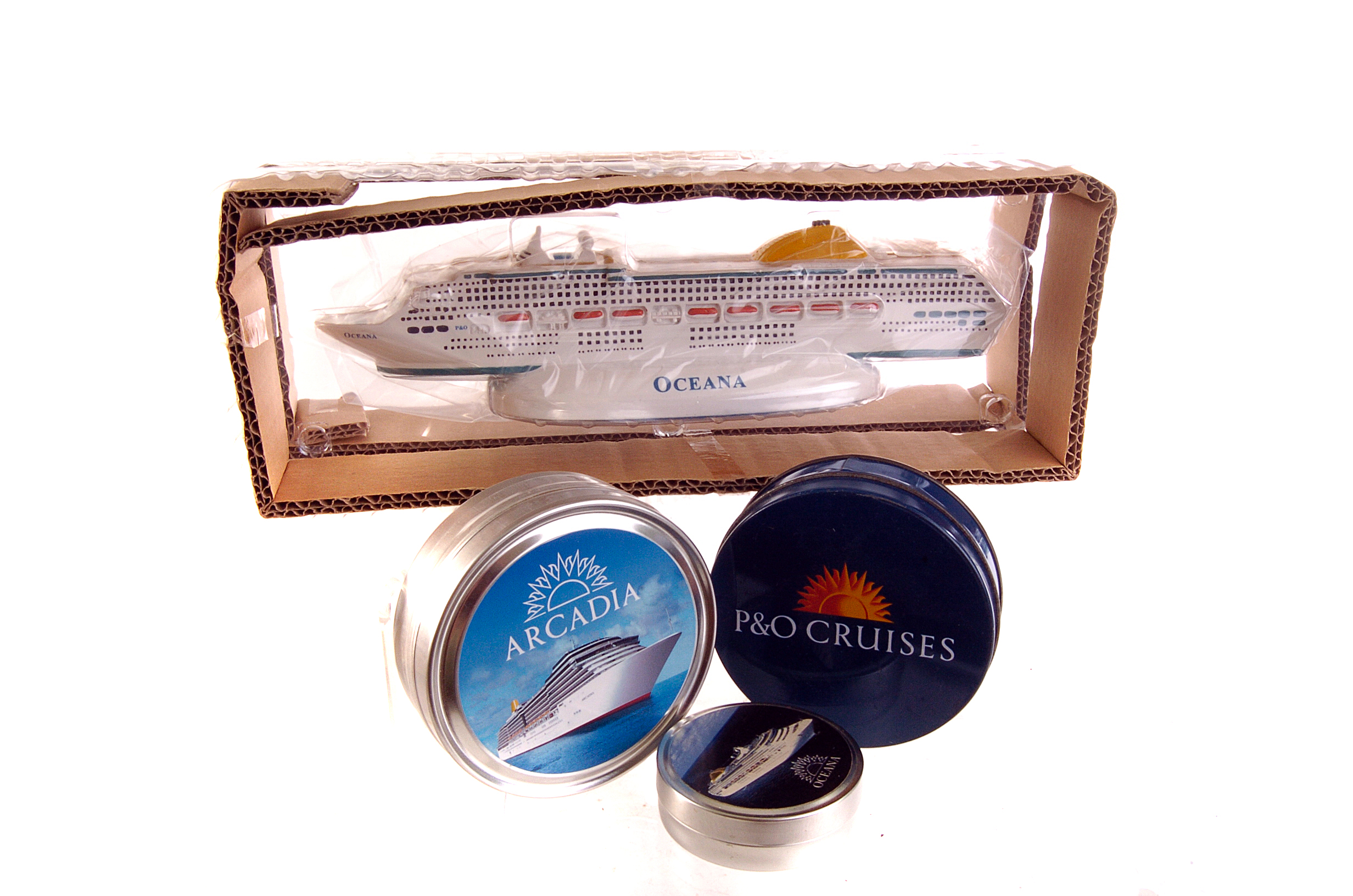 An Oceana ship figure, together with a selection of Oceana and Arcadia mint tins, some with