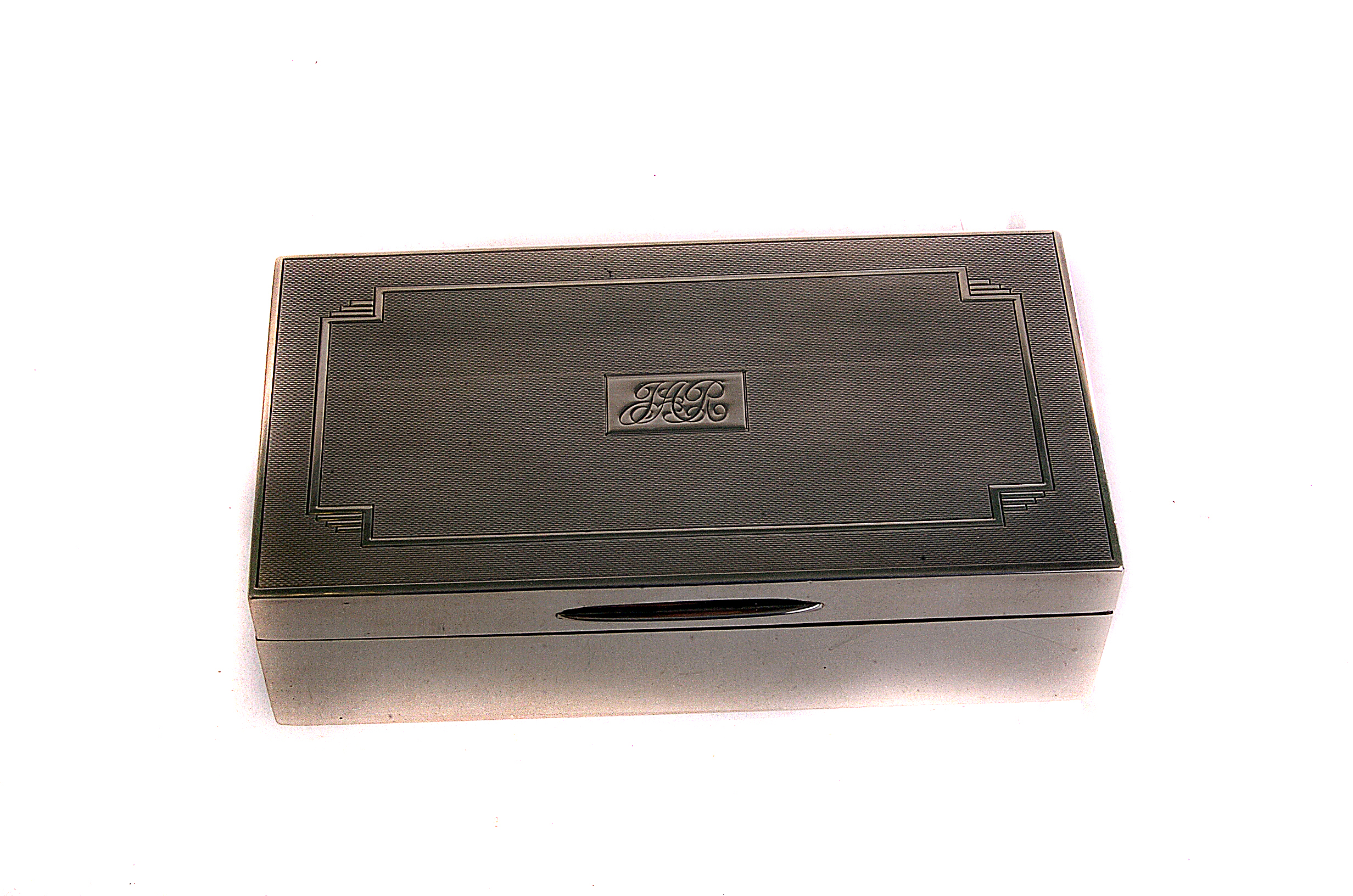 A modern silver cigarette box, from Mappin & Webb, having engine turned top and plain sides