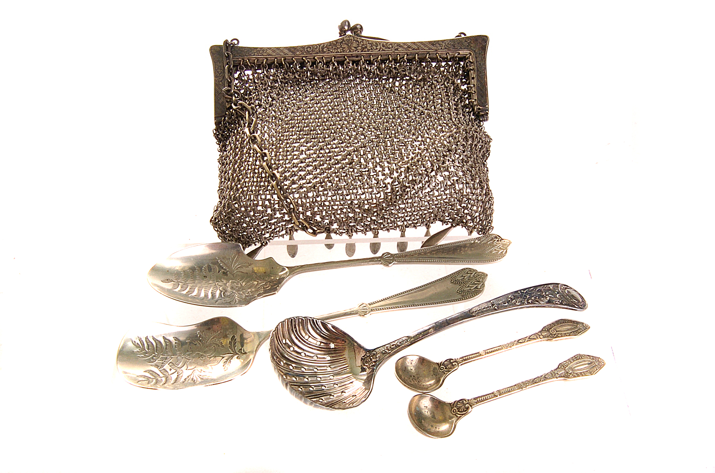 A selection of silver plated ware, comprising of various spoons, together with a chain mail purse (