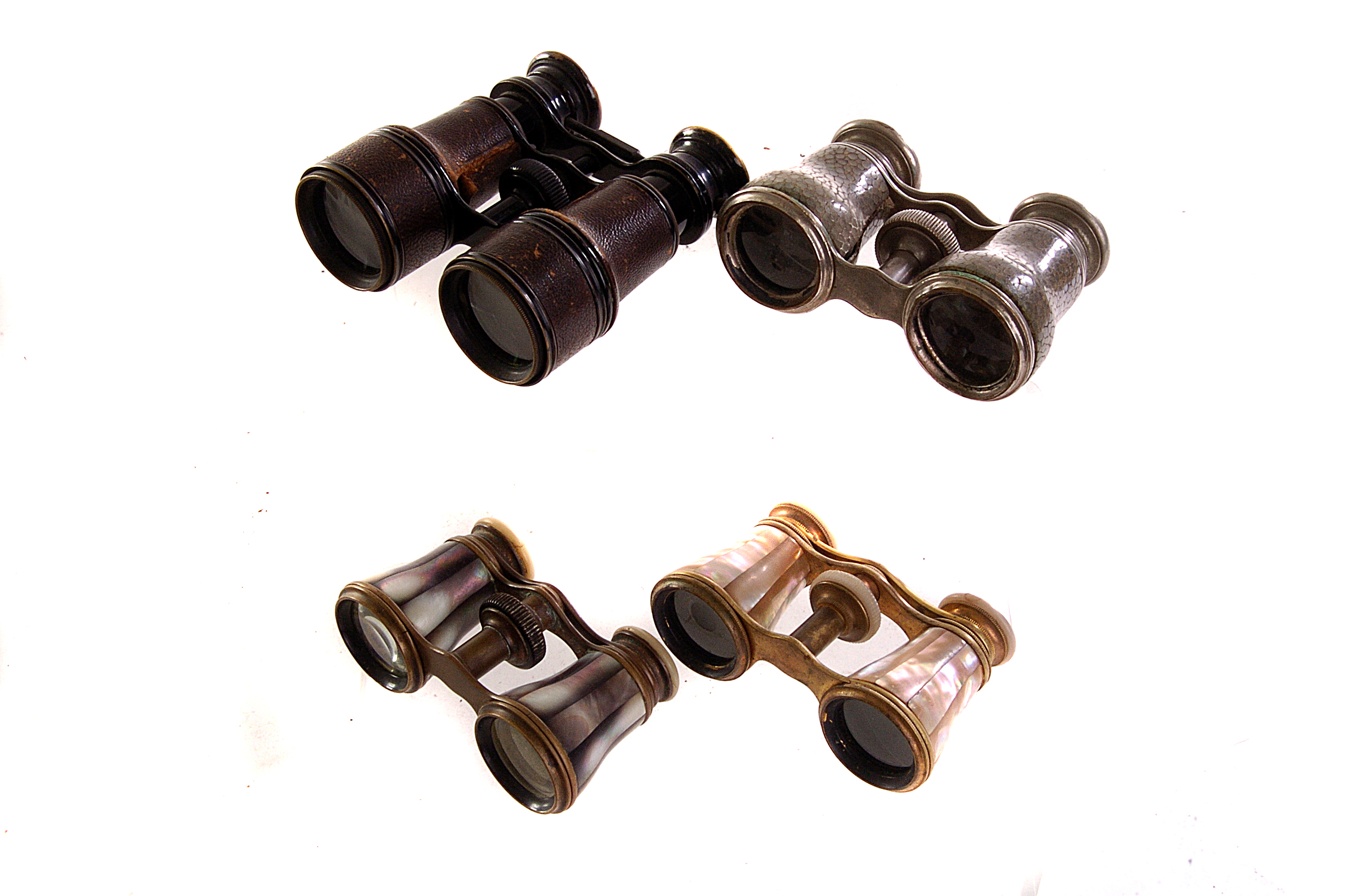 Four pairs of theatre/opera glasses, to include two mother of pearl examples (4)