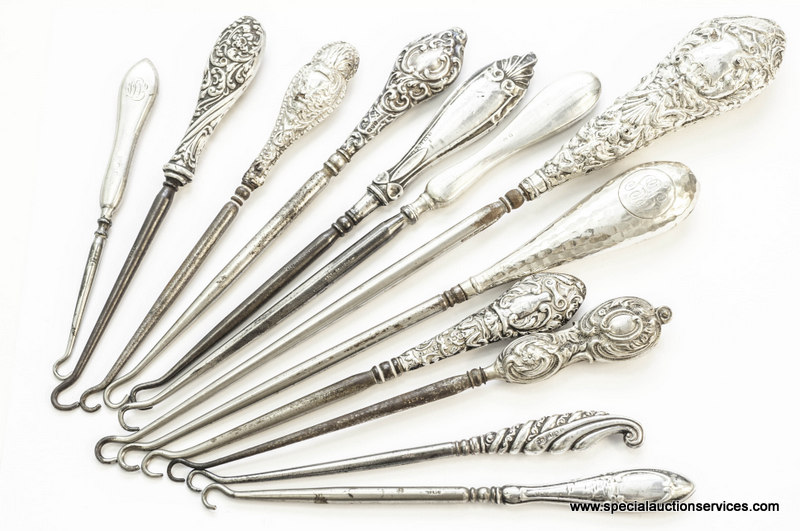 A collection of seventeen silver handled button hooks, some with embossed designs to handles,