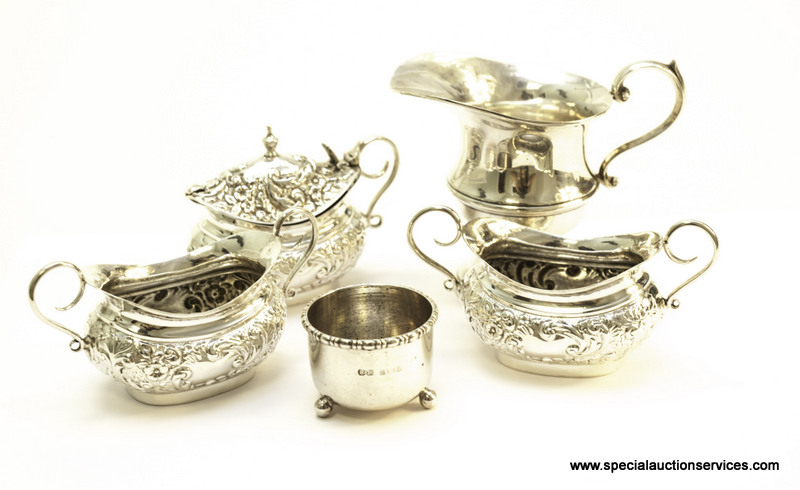 A group of silver salts and mustards, including examples marked Sheffield 1899, plus a George V