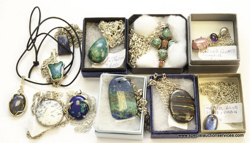 A good collection of silver and white metal mounted hardstone pendants, including a turquoise