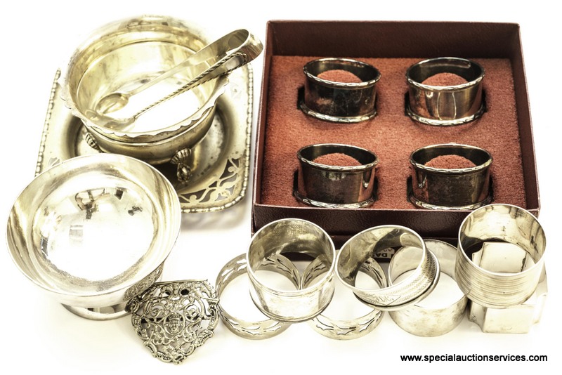 A George V silver sugar basin, together with silver napkin rings and a selection of silver plate (