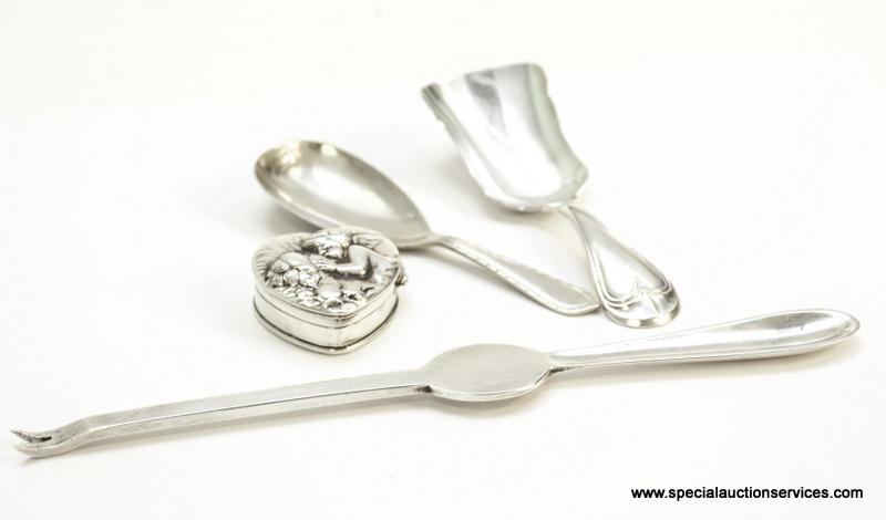 A George V silver lobster fork, together with two silver caddy spoons and a heart shaped box with