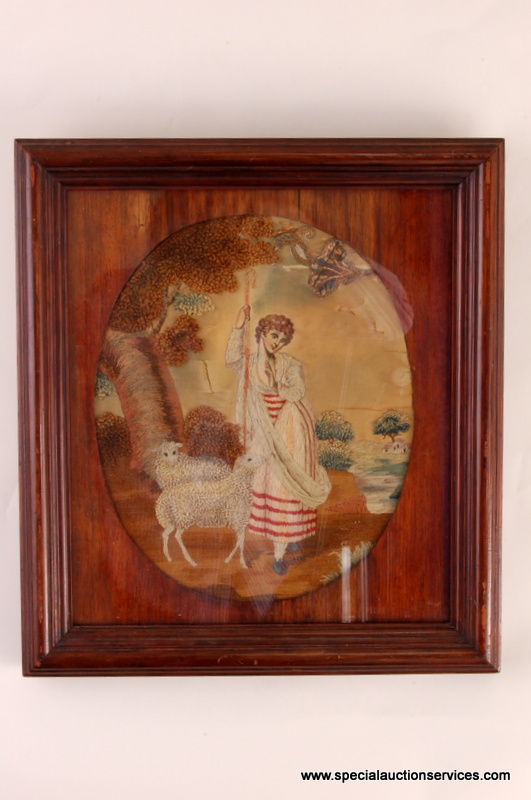 An 18th century wool work embroidery, featuring a shepherdess and her keep beneath a riverside