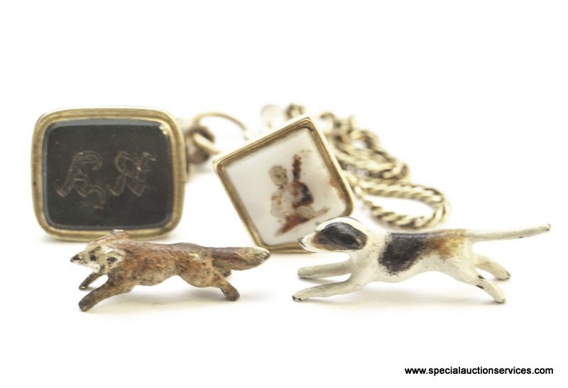 Two 9ct gold seals with lead holders, together with a cold painted fox and hound