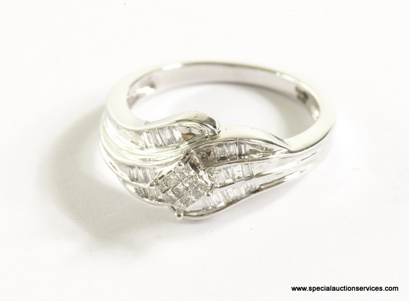 A 9ct white gold and diamond dress ring, the scroll style mount pave-set with baguette cuts and