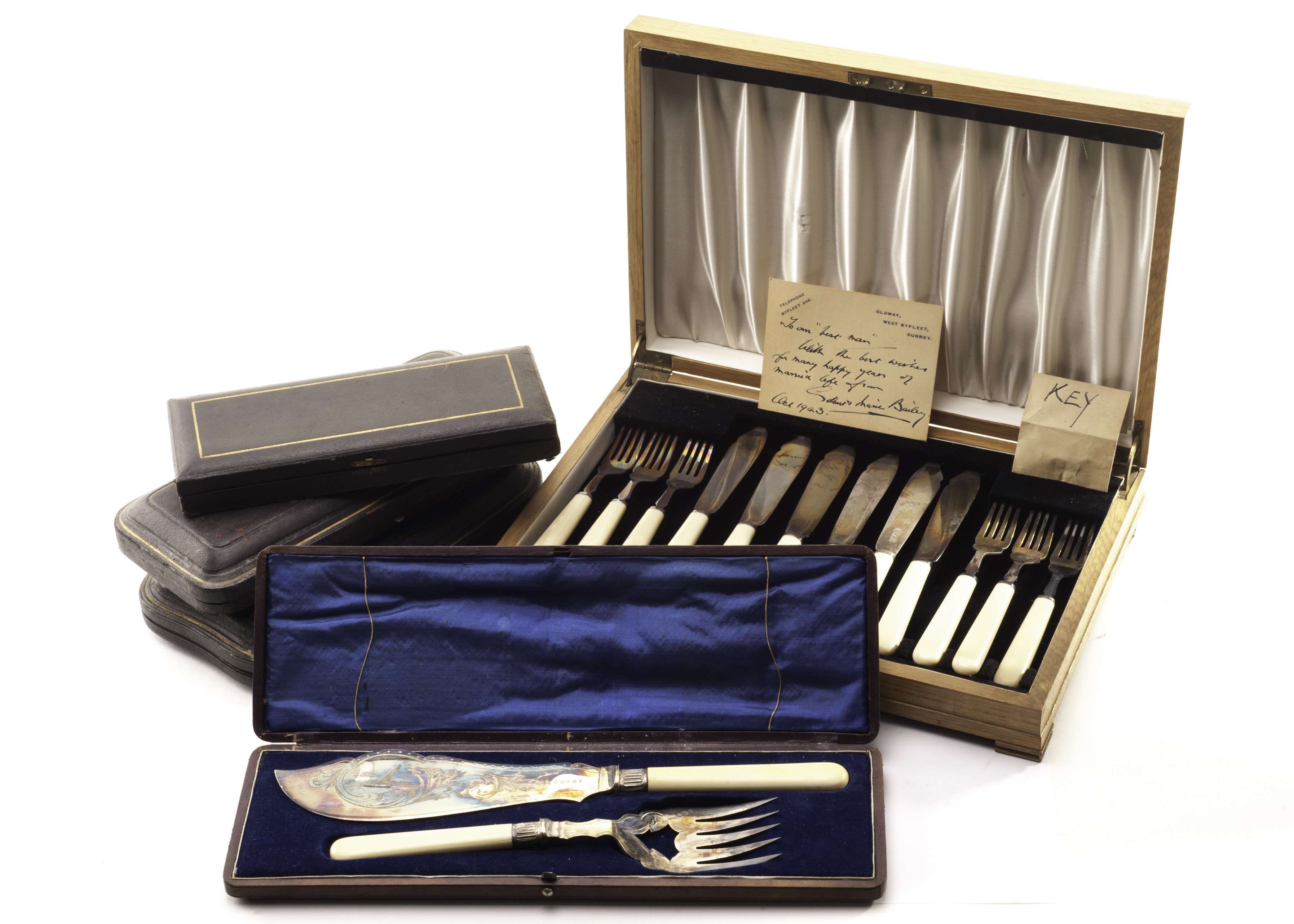 A cased set of six George VI silver and ivorine fish knives and forks, together with a cased pair