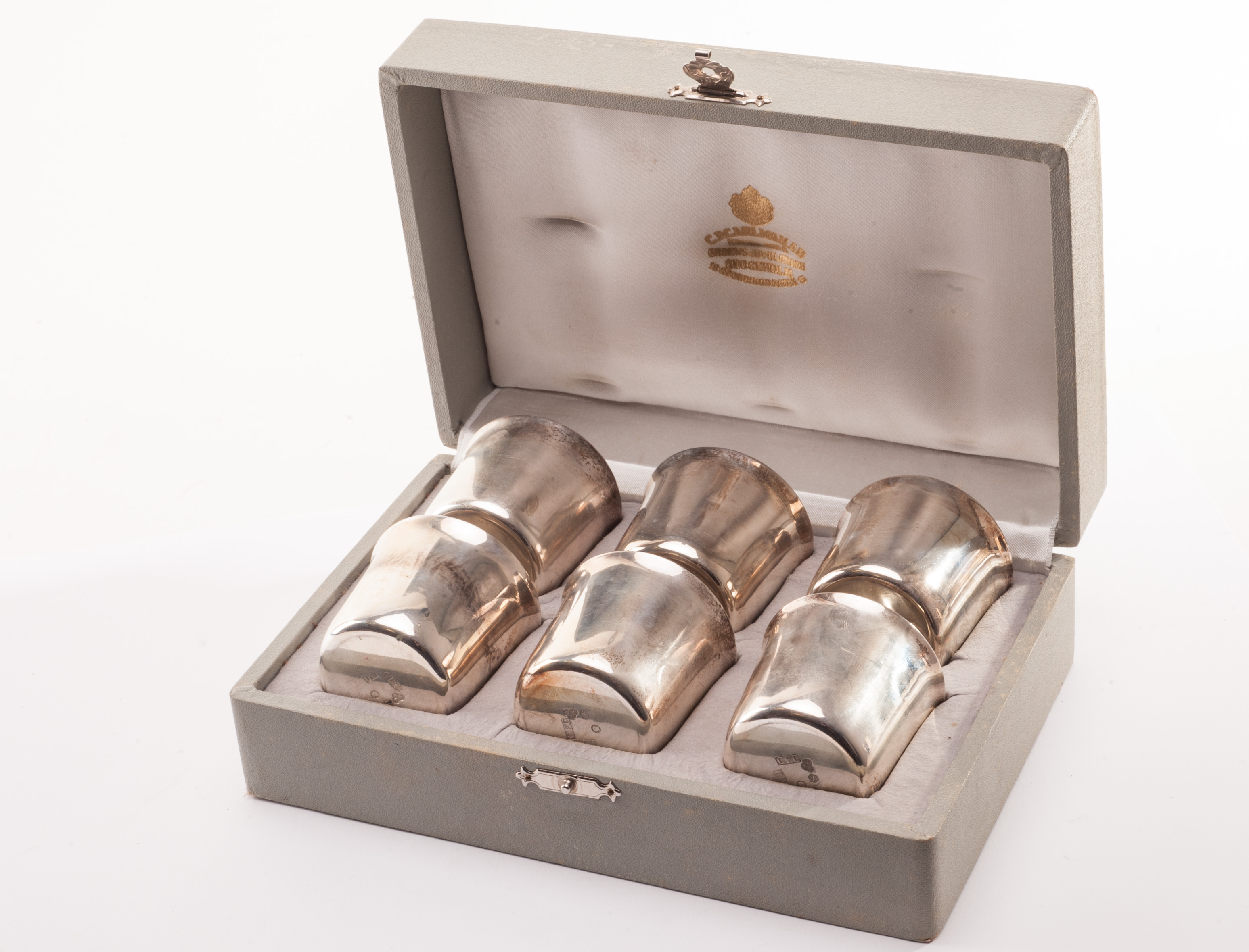 A cased set of six Swedish silver vodka tots from C.F.Carlnan, the six short beakers in fitted box