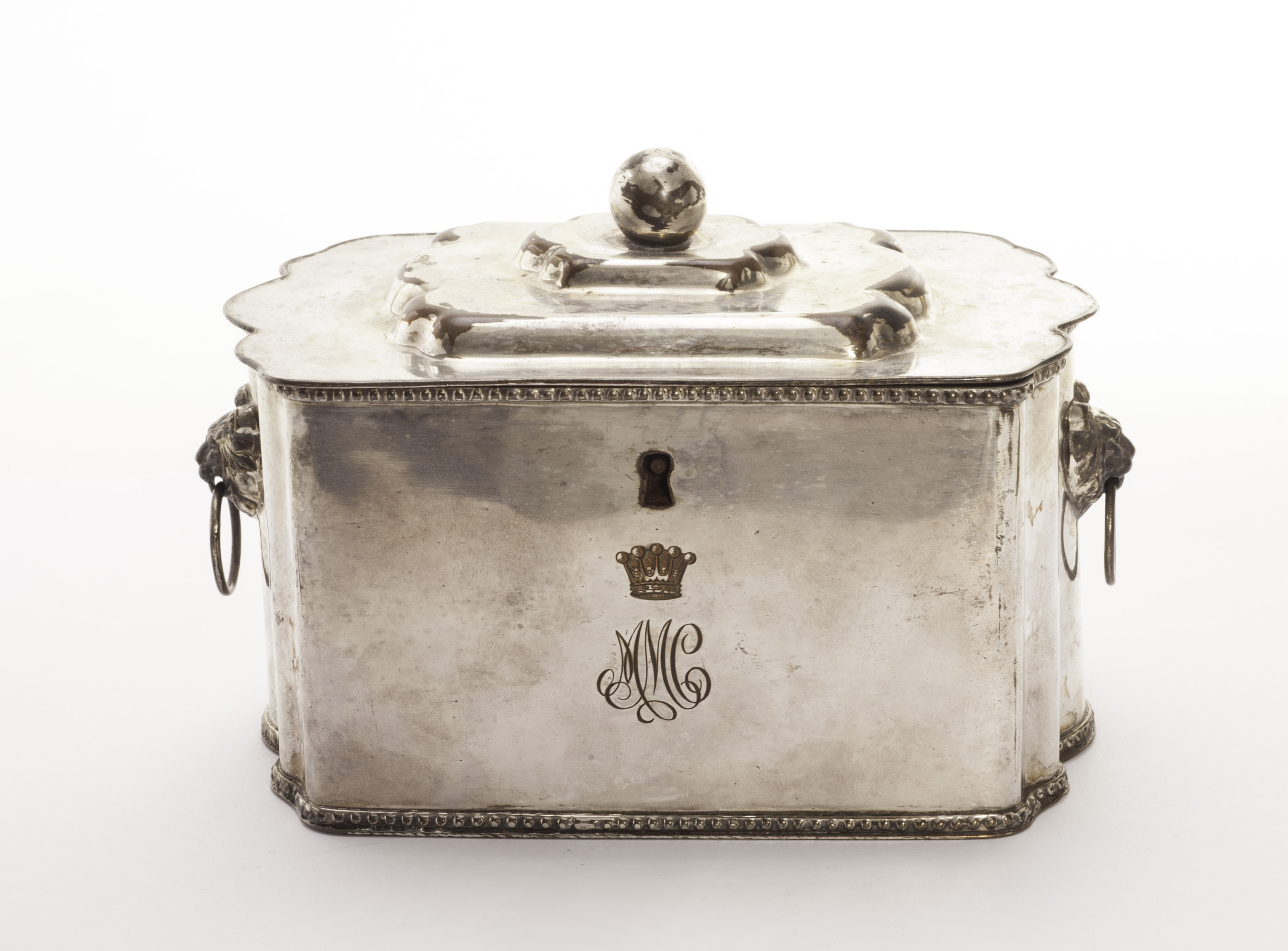 A 19th century Sheffield plate caddy, having stepped cover with ball finial, twin lion head and