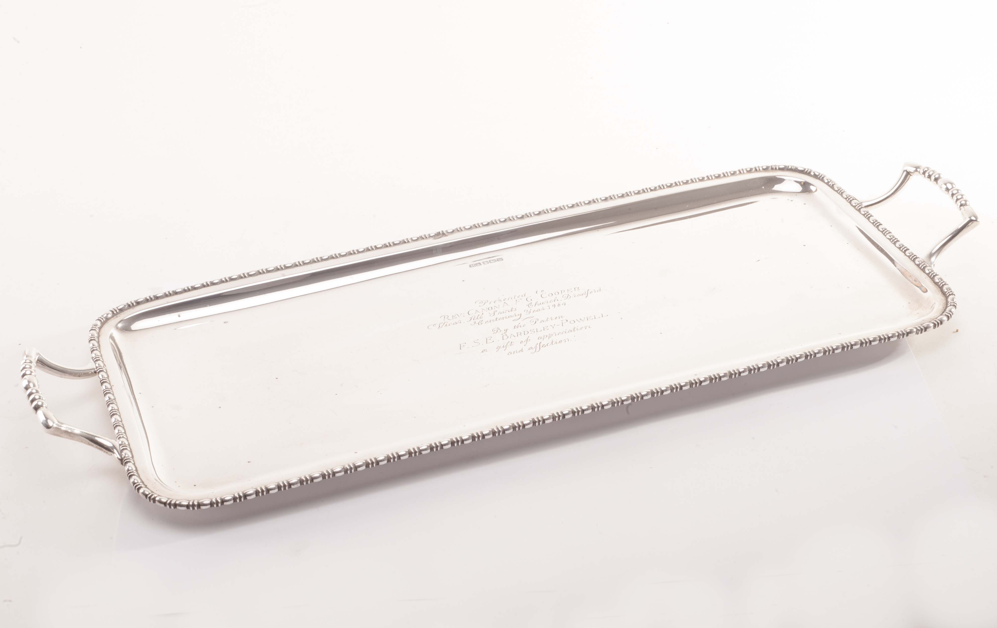 A George V silver rectangular tray by H.A, having egg and dart rim and twin handles, dated