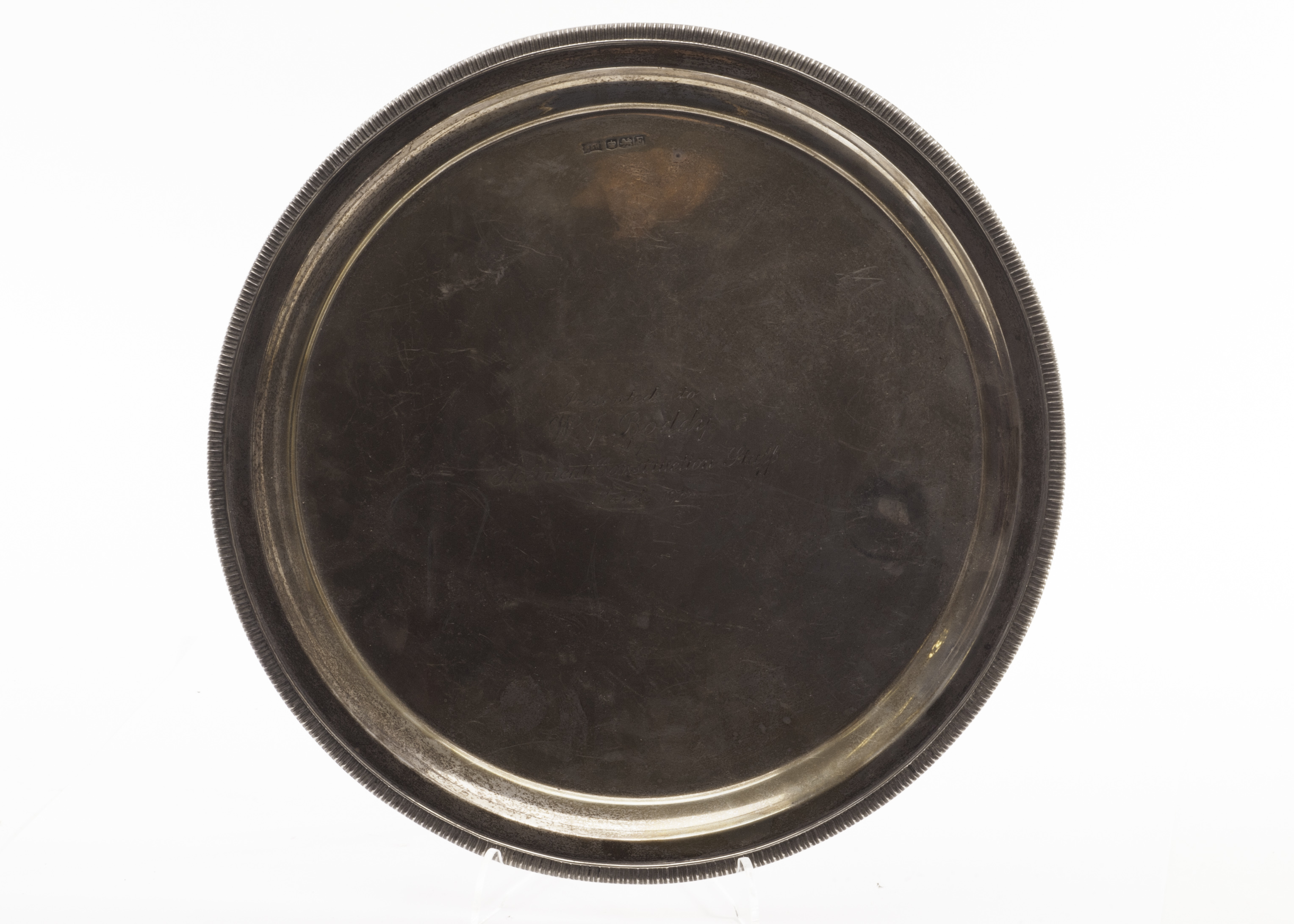 A George VI silver presentation salver by Walker & Hall, the circular tray dated Sheffield 1948,