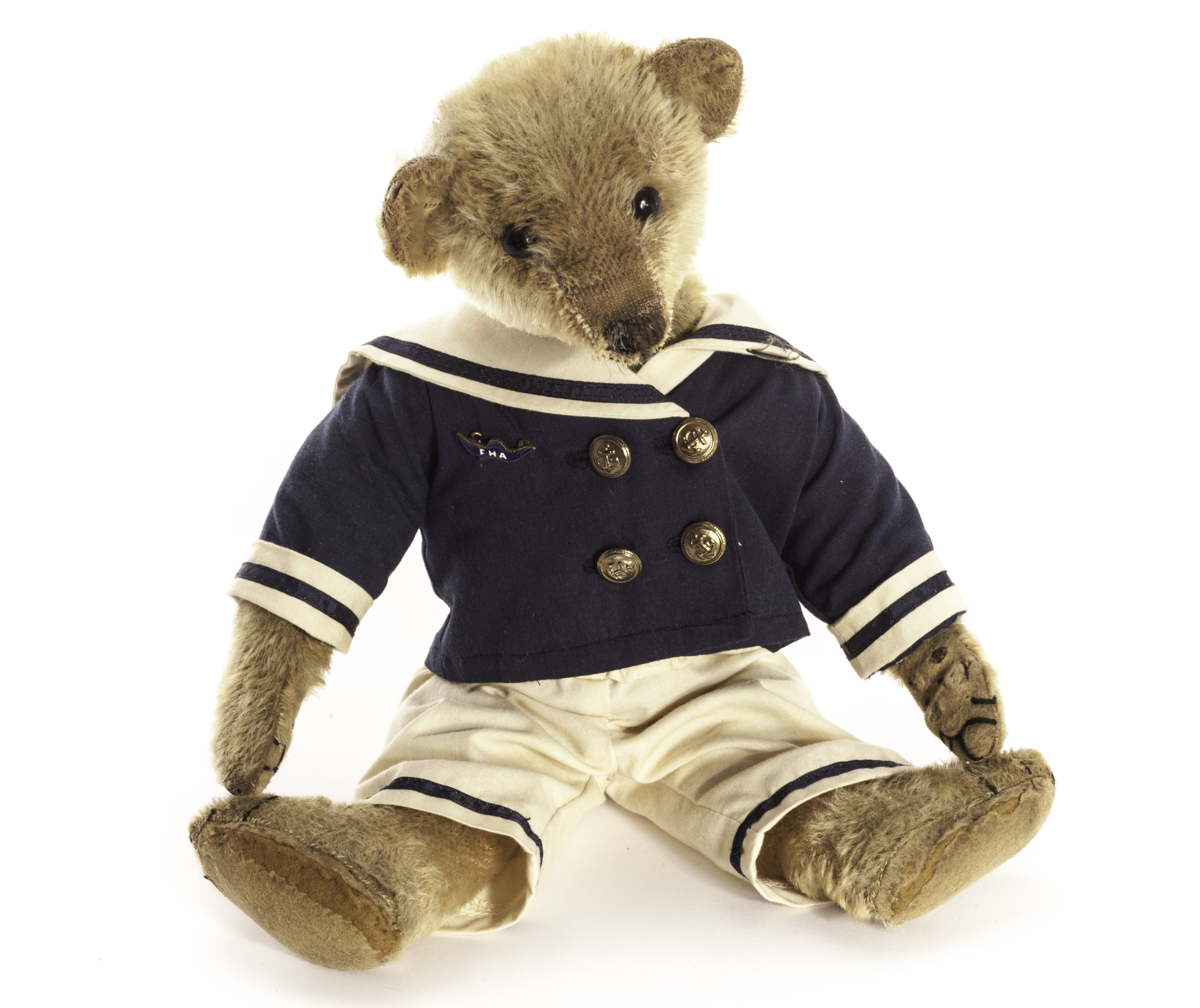 A J.K. Farnell Teddy Bear, circa 1912, with blonde mohair, black boot button eyes, pronounced