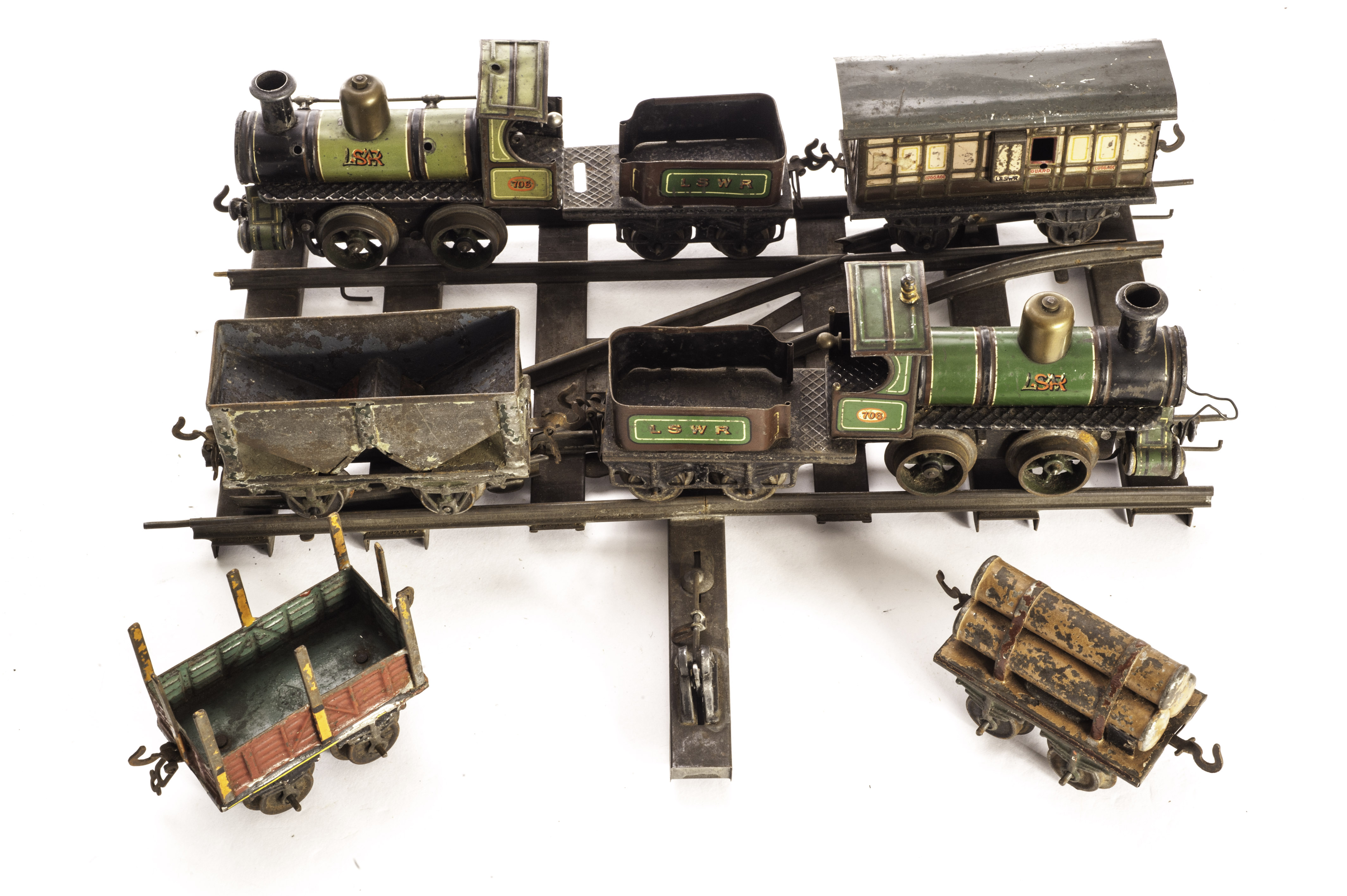 Early Bing 0 Gauge clockwork Loco­motives and Tender with Rolling Stock and Track: LSWR 0-4-0