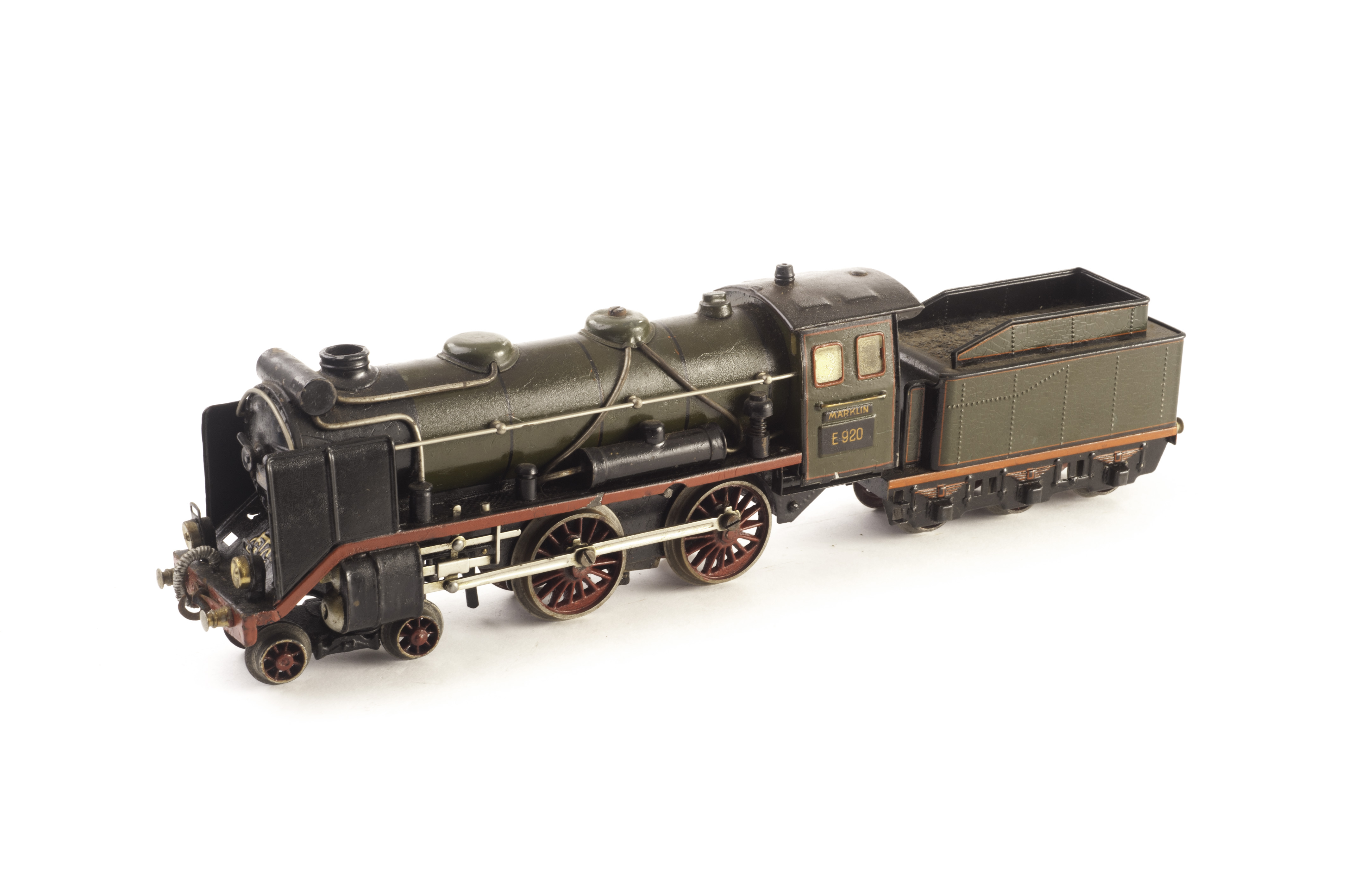 A Märklin clockwork Continental 4-4-0 locomotive and 6-wheel tender, No. E 920, in lined green