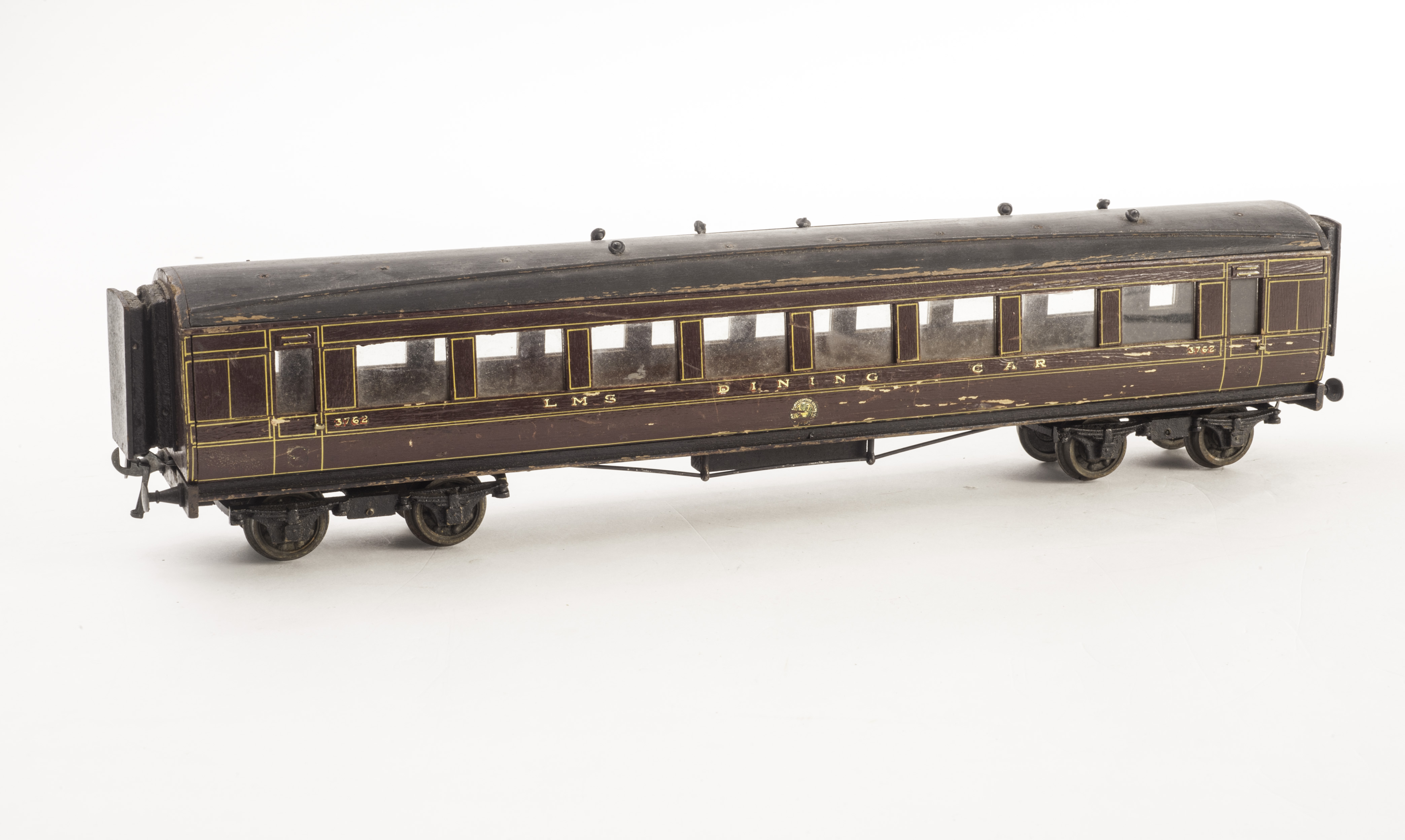 A Millbro 0 Gauge LMS Dining Car, all wood construction, in crimson lake with black roof, F