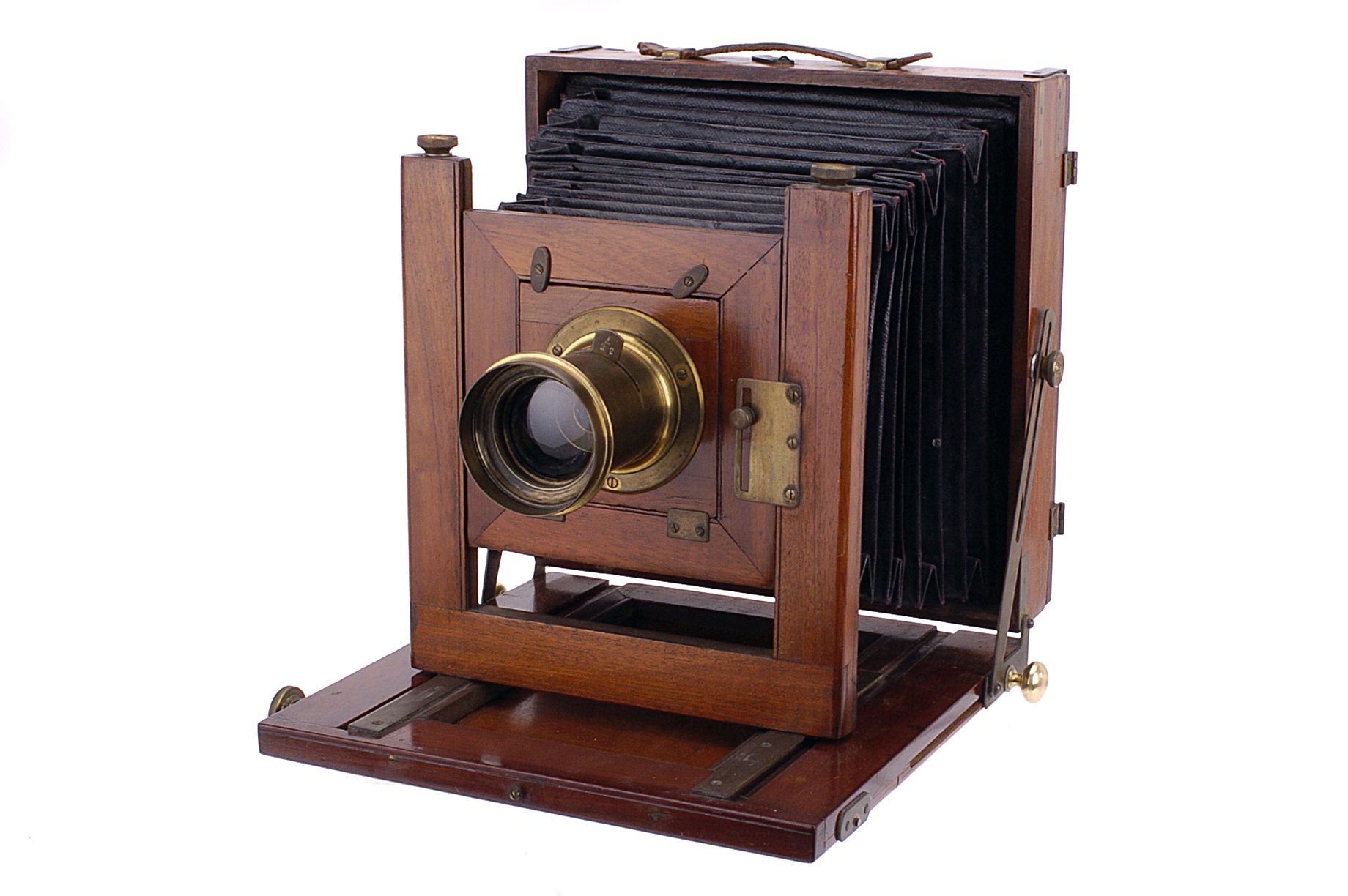 A Talbot & Eamer Whole Plate Camera, brass bound, with unmarked lens, with f22 Waterhouse stop,