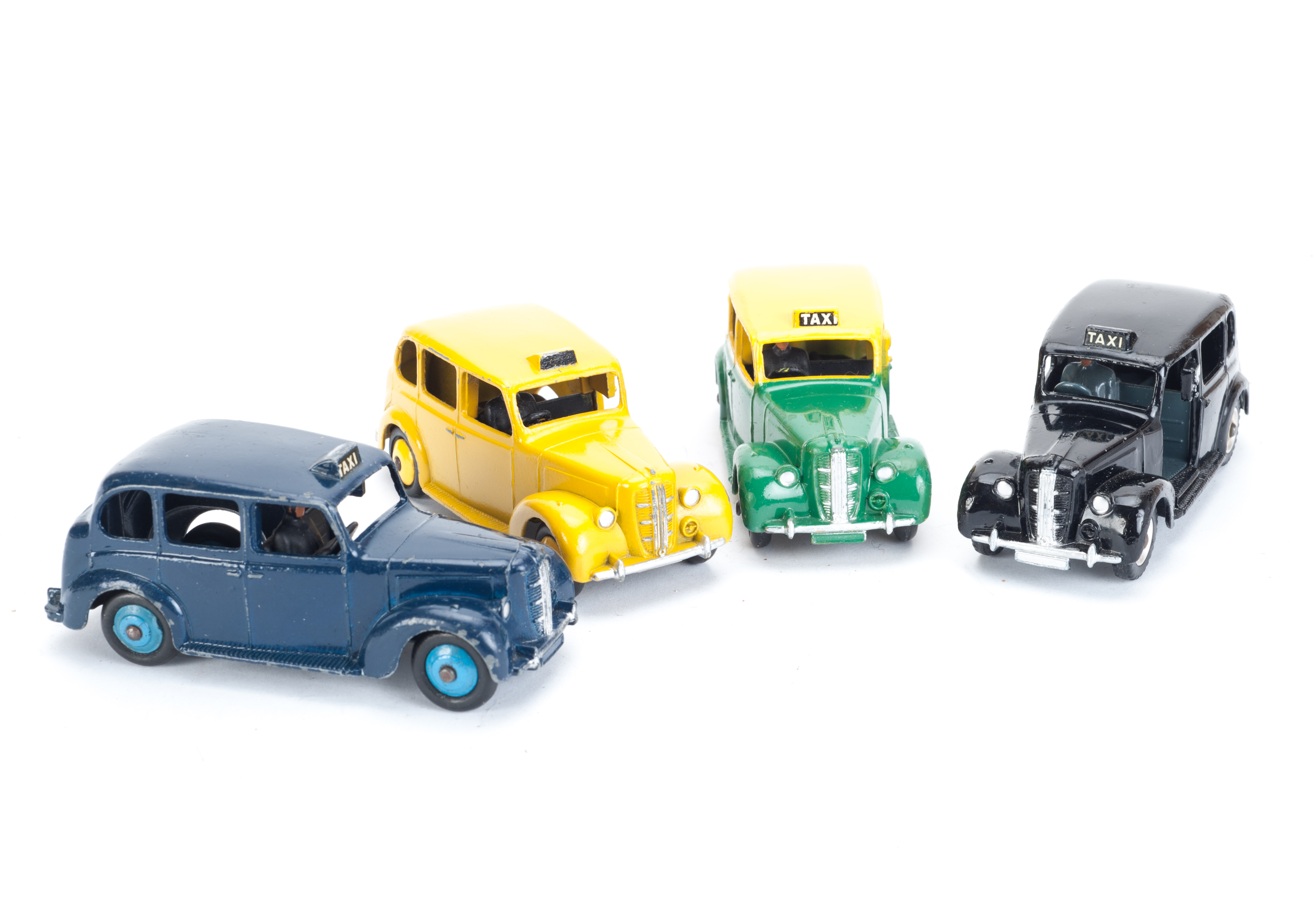 Dinky Toys 40h/254 Austin Taxi, four variations, one black body, spun hubs, one dark blue body, mid