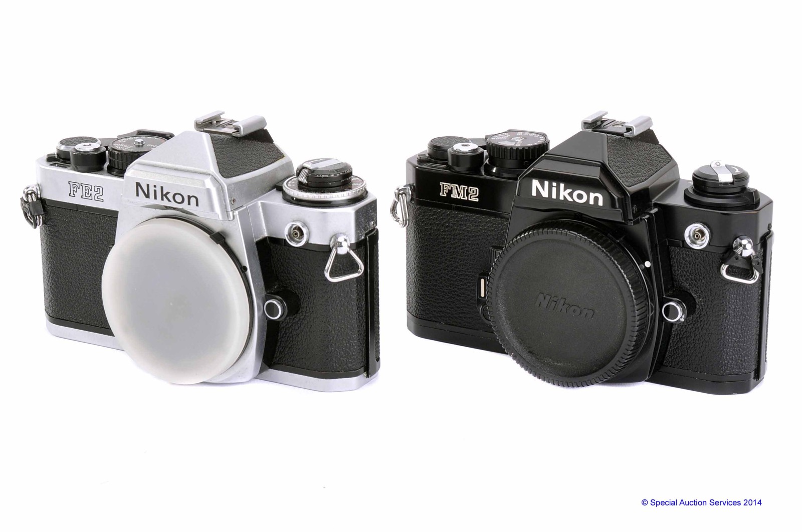 Nikon SLR Bodies: FM2n, black, serial no. 7367387, VG, shutter working, FE2, chrome, serial no.