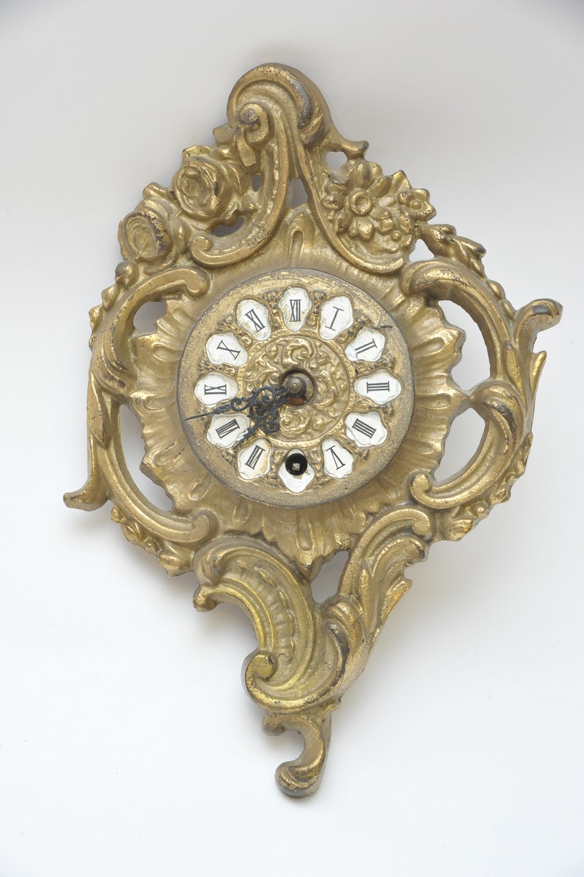 A brass French style wall clock, the dial with enamel Roman numerals