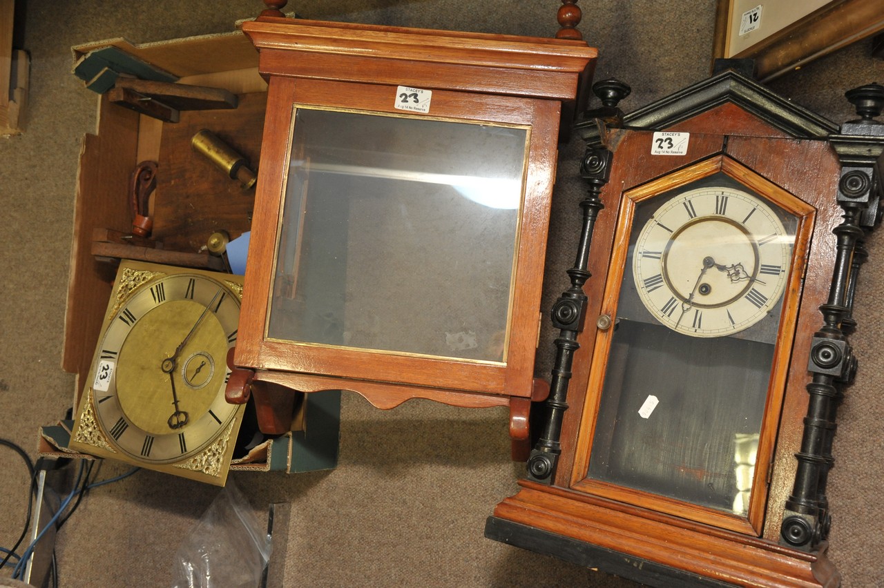 A large clock face, two hoods and other clock spares