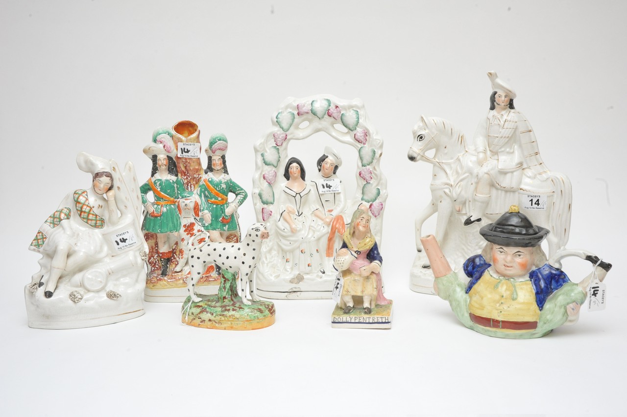 A collection of Staffordshire flatback figures, a teapot and dalmation