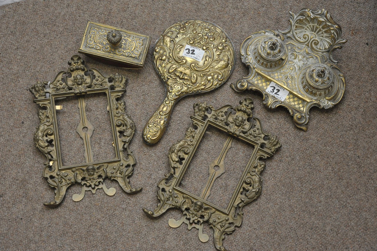 A cast metal desk set, pair of picture frames and a hand mirror