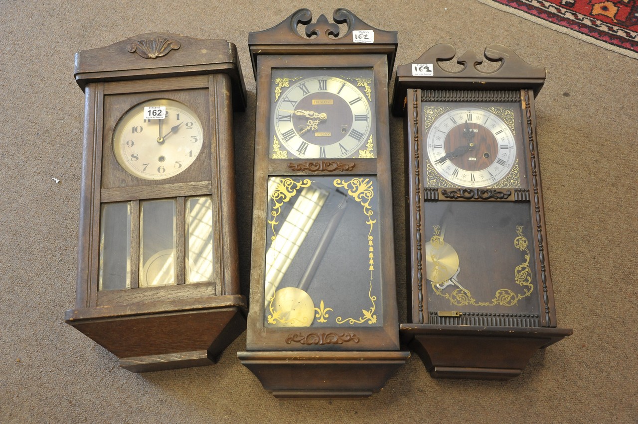 Three old wall clocks
