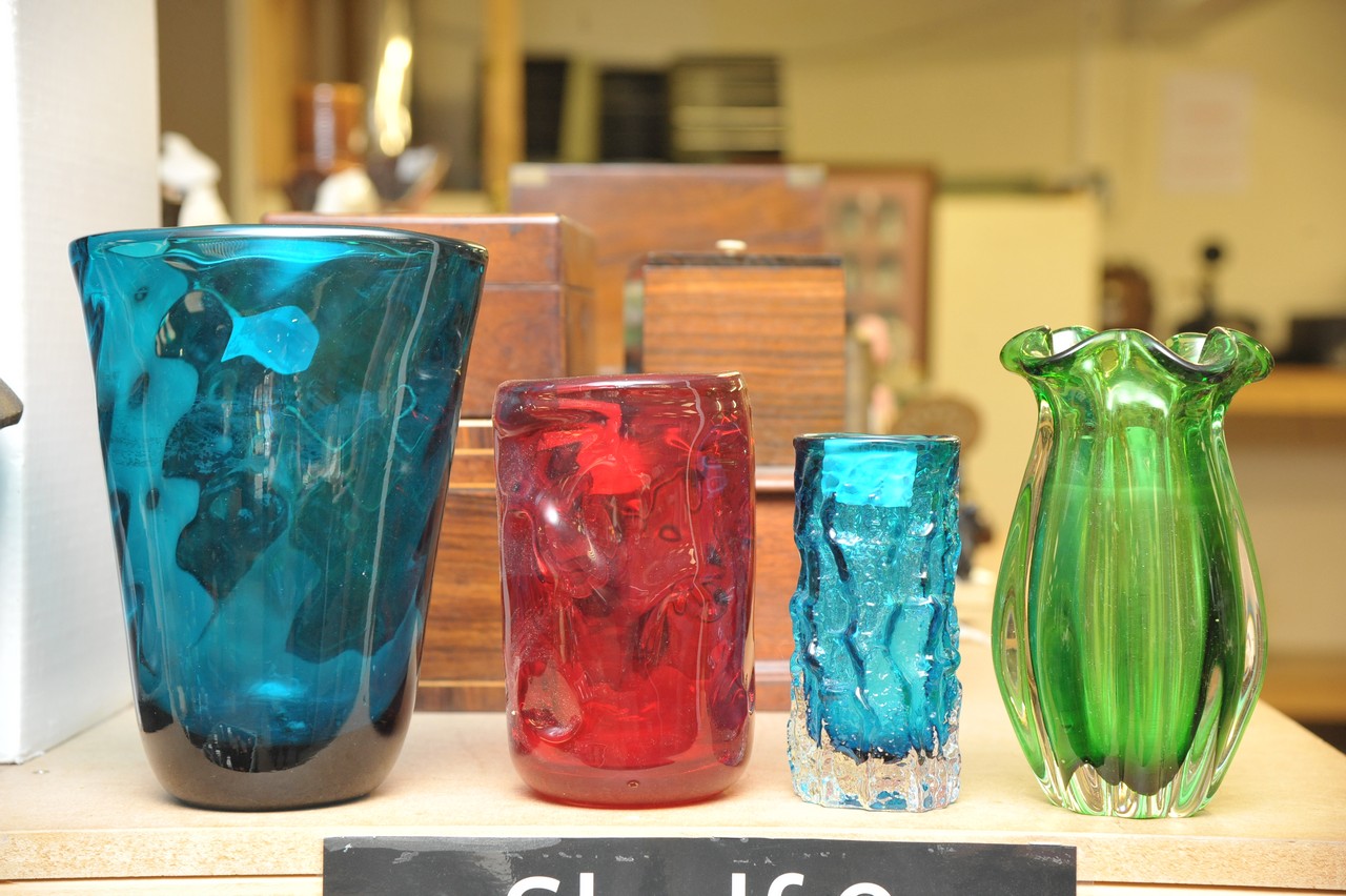 A Whitefriars glass bark vase in Kingfisher colour, a red knobbly vase and two other vases