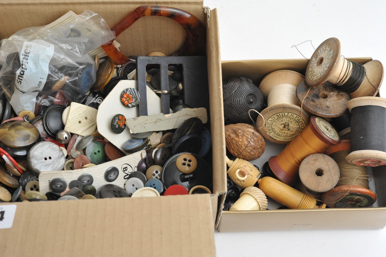 A collection of sewing items and various buttons