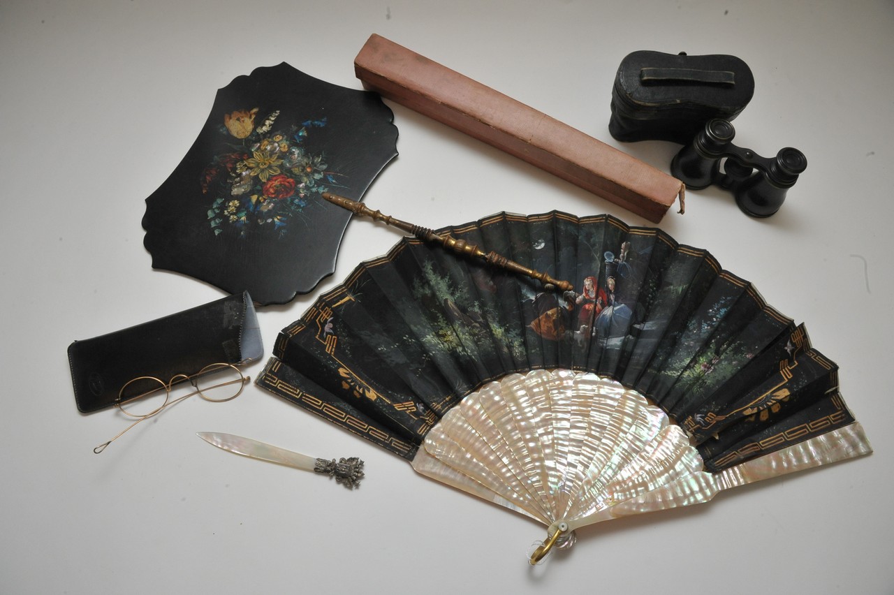 A boxed painted fan with Mother of Pearl sticks, pair of opera glasses and other oddments